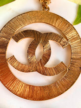 Load image into Gallery viewer, CHANEL MASSIVE ICONIC SUN BURST LOGO CELEBRITY HOOP EARRINGS 1992