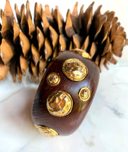 Load image into Gallery viewer, CHANEL RARE VINTAGE WOOD 1990 HIGHLY COLLECTABLE BANGLE BRACELET WITH GILT HAMMERED MEDALLIONS