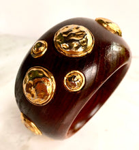 Load image into Gallery viewer, CHANEL RARE VINTAGE WOOD 1990 HIGHLY COLLECTABLE BANGLE BRACELET WITH GILT HAMMERED MEDALLIONS