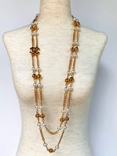Load image into Gallery viewer, CHANEL UNIQUE TURNLOCK SET OF 2 SAUTOIR NECKLACES WITH PEARLS AND LOGOS