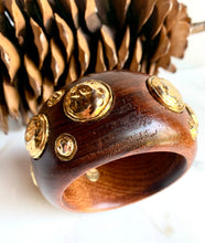Load image into Gallery viewer, CHANEL RARE VINTAGE WOOD 1990 HIGHLY COLLECTABLE BANGLE BRACELET WITH GILT HAMMERED MEDALLIONS