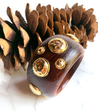 Load image into Gallery viewer, CHANEL RARE VINTAGE WOOD 1990 HIGHLY COLLECTABLE BANGLE BRACELET WITH GILT HAMMERED MEDALLIONS