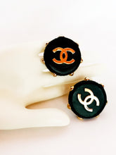 Load image into Gallery viewer, CHANEL HUGE LEATHER GOLD STUDDED RARE LOGO EARRINGS