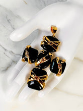Load image into Gallery viewer, CHANEL GOOSSENS BLACK GRIPOIX POURED GLASS CC LOGO "RIBBON" WRAPPED CROSS PENDANT