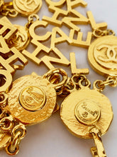 Load image into Gallery viewer, CHANEL 3 STRAND CHANEL LETTERS LOGO NECKLACE 18 CHANEL CLUSTERS AND 18 LOGO MEDALLIONS