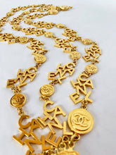 Load image into Gallery viewer, CHANEL 3 STRAND CHANEL LETTERS LOGO NECKLACE 18 CHANEL CLUSTERS AND 18 LOGO MEDALLIONS