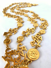 Load image into Gallery viewer, CHANEL 3 STRAND CHANEL LETTERS LOGO NECKLACE 18 CHANEL CLUSTERS AND 18 LOGO MEDALLIONS