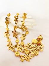 Load image into Gallery viewer, CHANEL 3 STRAND CHANEL LETTERS LOGO NECKLACE 18 CHANEL CLUSTERS AND 18 LOGO MEDALLIONS