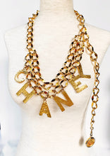 Load image into Gallery viewer, CHANEL C-H-A-N-E-L CHARMS GILT CHAIN BELT