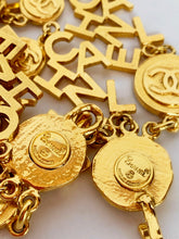 Load image into Gallery viewer, CHANEL 3 STRAND CHANEL LETTERS LOGO NECKLACE 18 CHANEL CLUSTERS AND 18 LOGO MEDALLIONS
