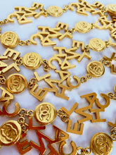 Load image into Gallery viewer, CHANEL 3 STRAND CHANEL LETTERS LOGO NECKLACE 18 CHANEL CLUSTERS AND 18 LOGO MEDALLIONS
